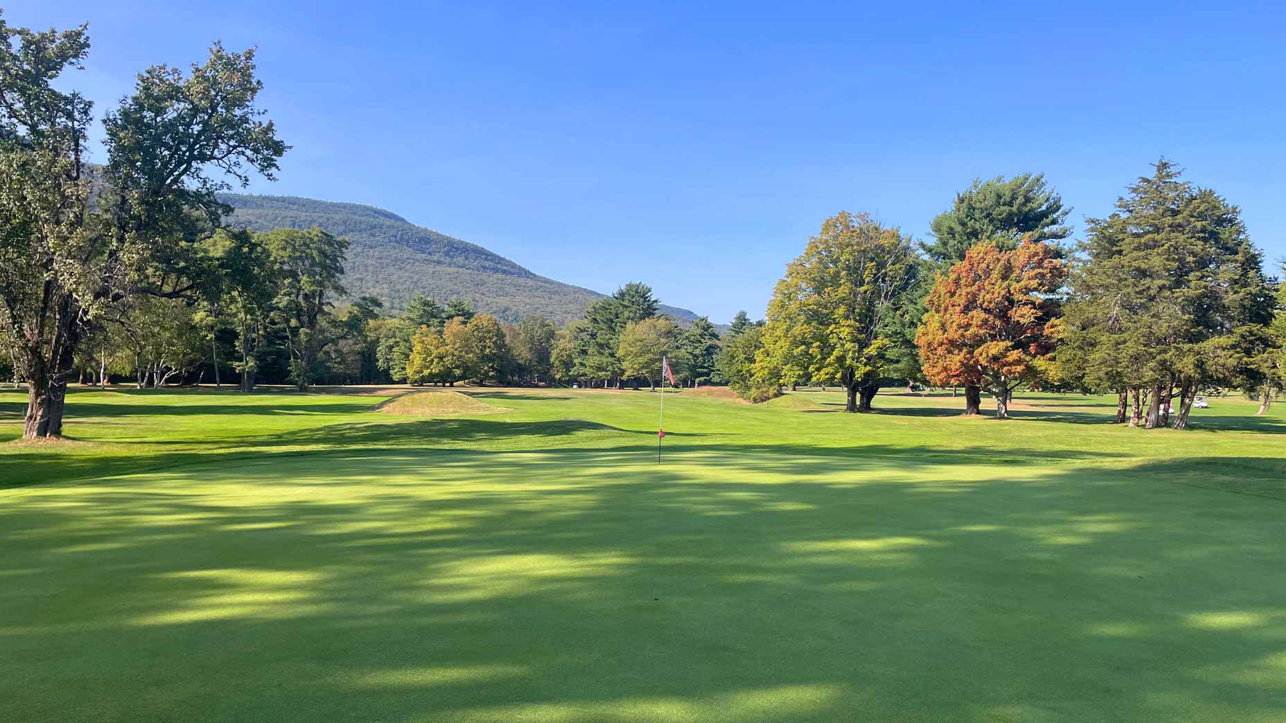 A scenic view of Rip Van Winkle Country Club with Catskilll Mountains i background.