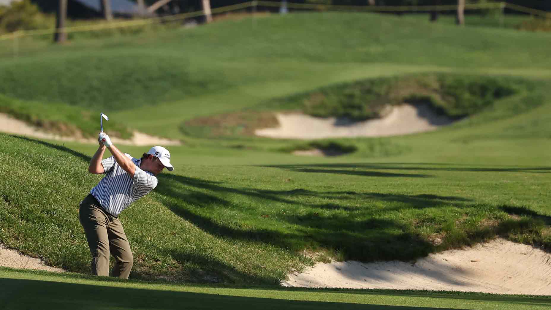 GOLF Top 100 Teacher Brian Mogg shares his tips when faced with a 100-yard bunker shot, which can be difficult when between clubs