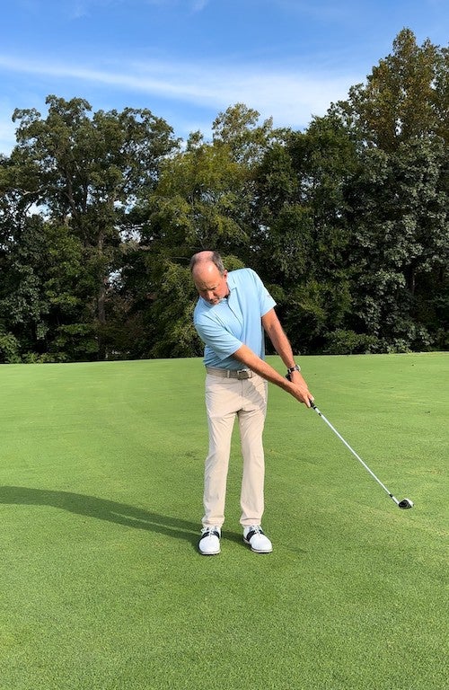 How the follow through should look on a 9-iron scooter shot