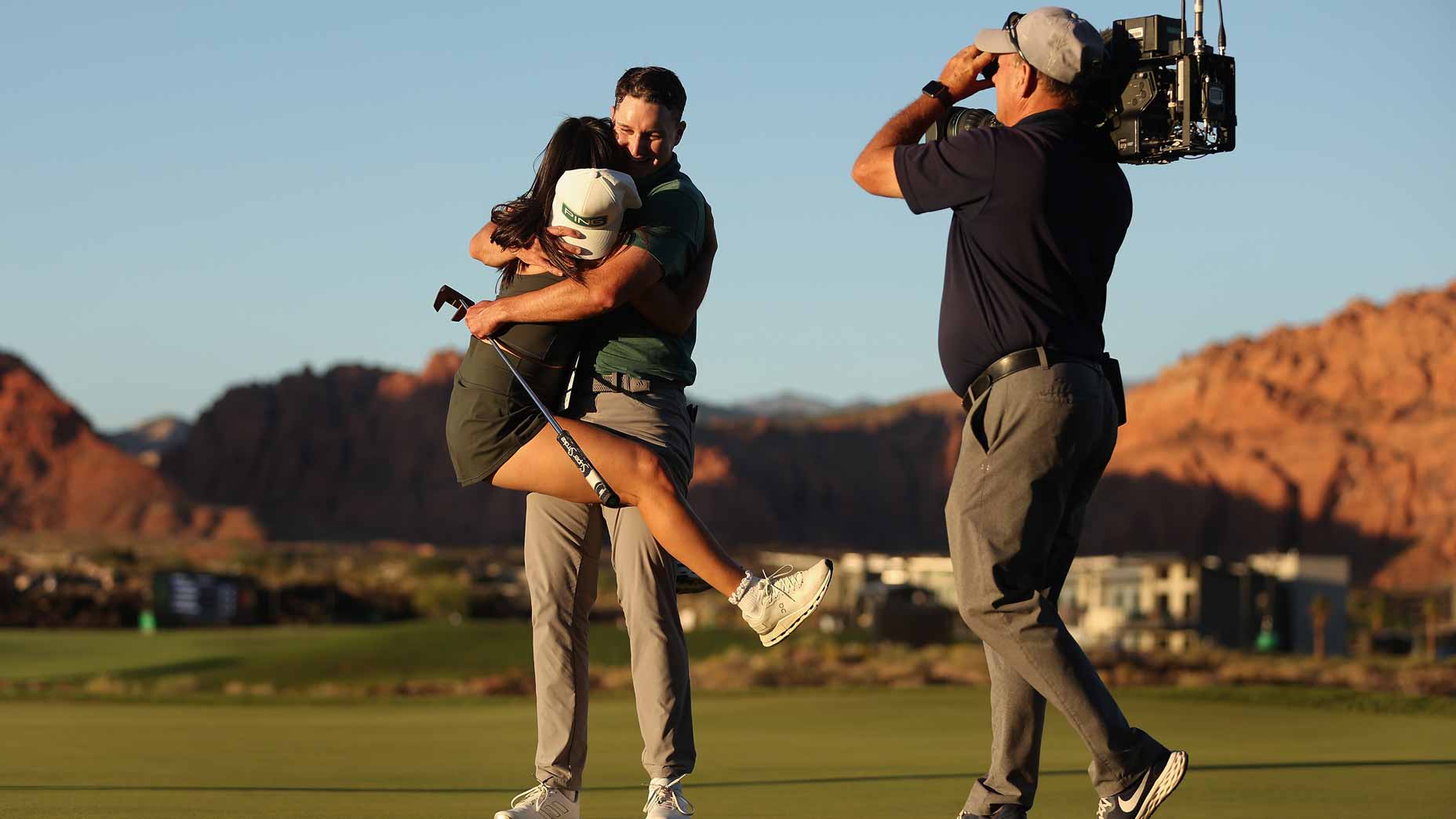 Matt McCarty hugs his girlfriend after winning the Black Desert Championship.