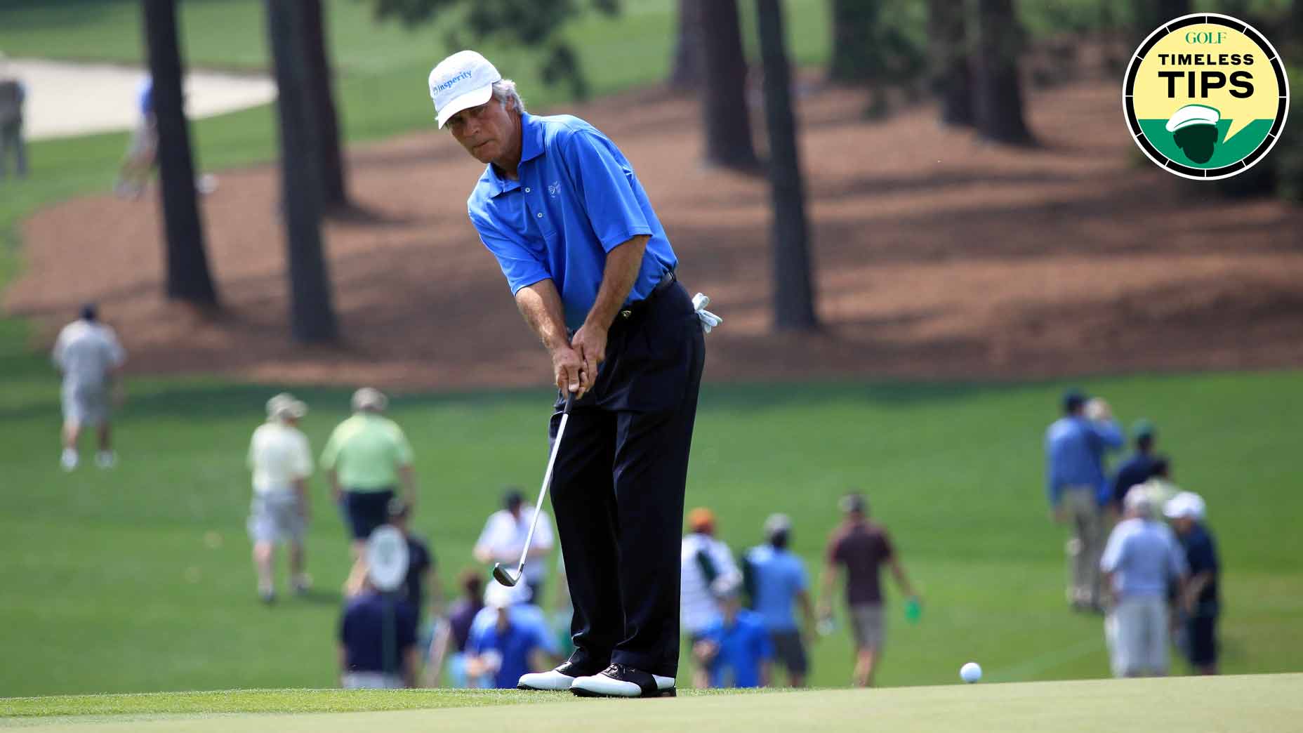 ben crenshaw hits a lag putt during a practice round at the 2012 masters