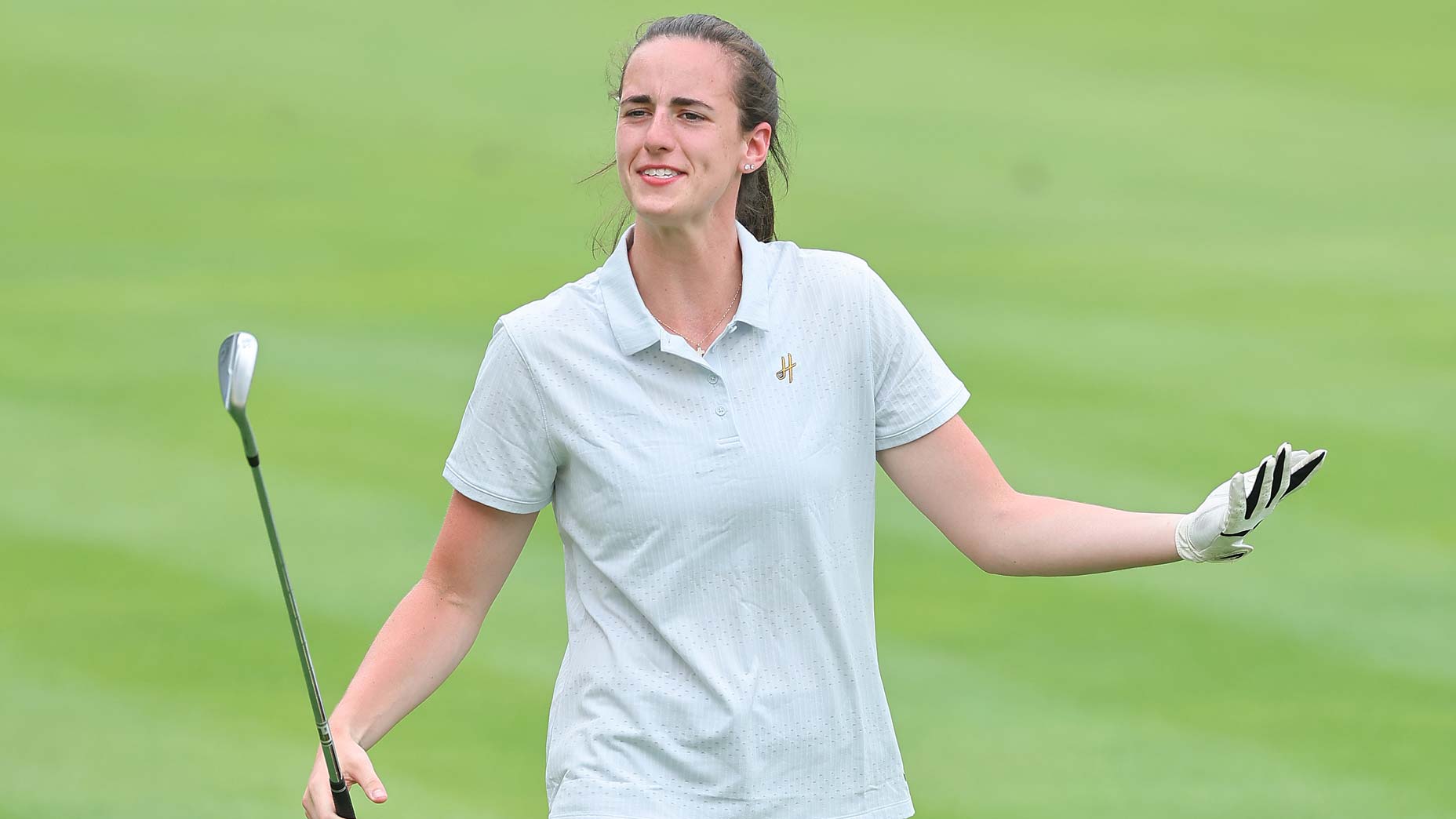 WNBA star Caitlin Clark reacts during the pro-am prior to the 2024 John Deere Classic at TPC Deere Run.