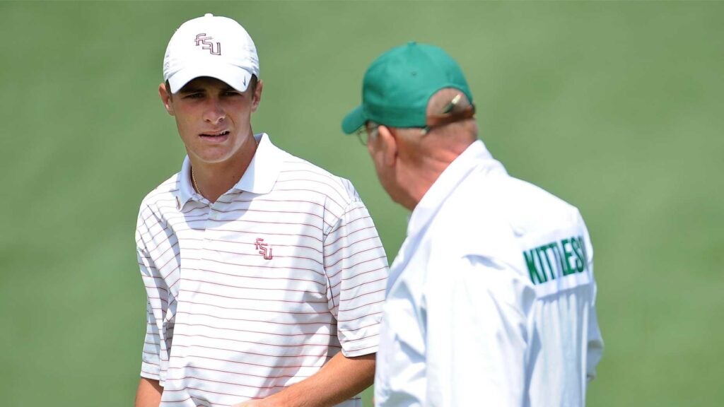 drew kittleson smiles at caddie at the masters in florida state shirt