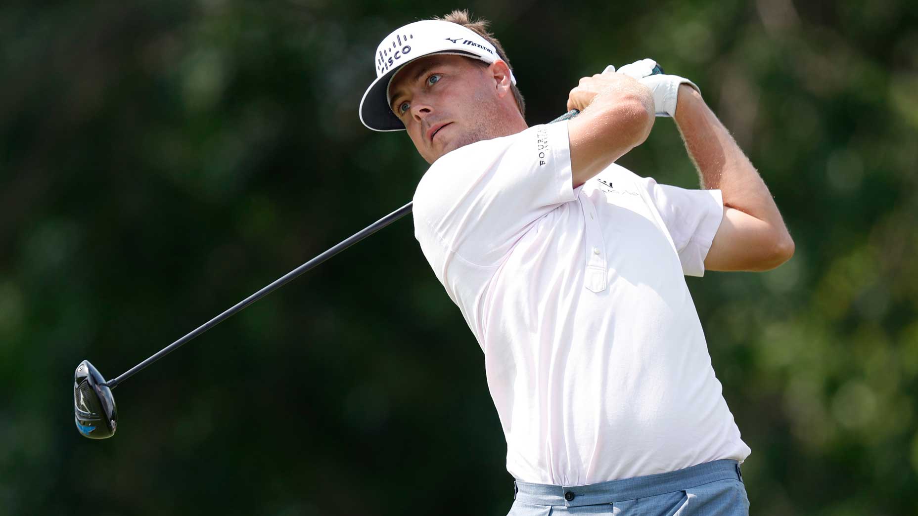 Pro golfer Keith Mitchell plays his shot from the 10th tee during the second round of the 3M Open at TPC Twin Cities.