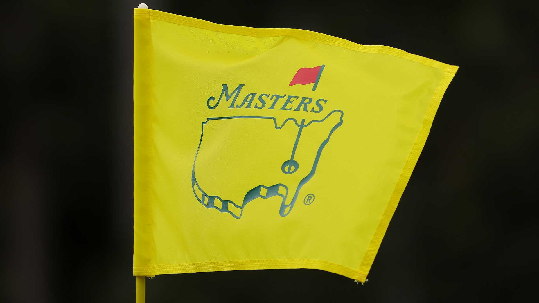 augusta national flag flaps in the wind at the Masters