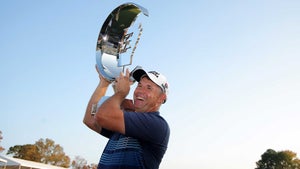 Padraig Harrington hoists the trophy after winning the Simmons Bank Championship on Sunday in Little Rock, Ark.