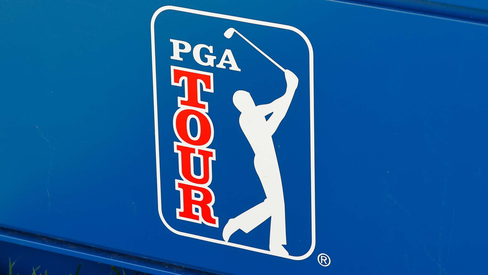 A PGA Tour logo pictured on a granstand at a tourament.