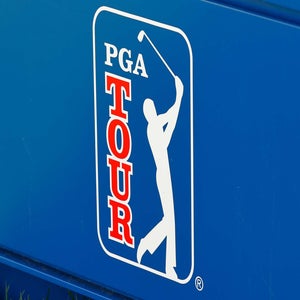 A PGA Tour logo pictured on a granstand at a tourament.