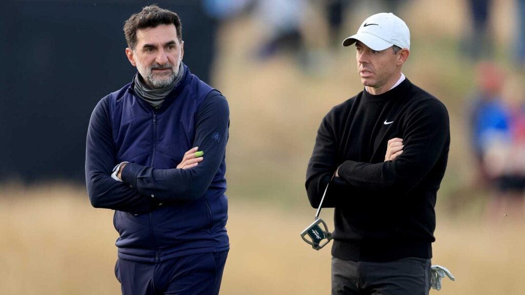 Rory McIlroy waits to putt on the 17th hole with Yasir Al-Rumayyan during the third round of the 2024 Alfred Dunhill Links Championship on The Old Course at St Andrews on October 05, 2024.