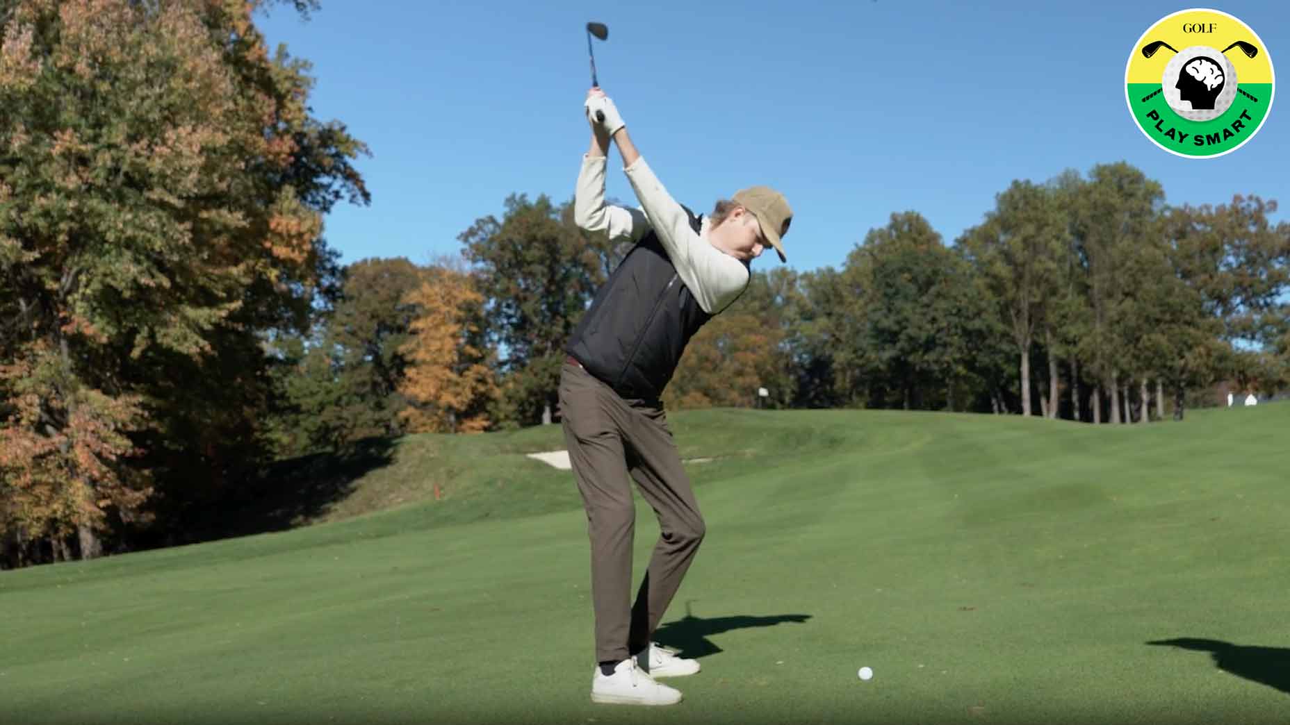 GOLF Editor Zephyr Melton hits a wedge shot