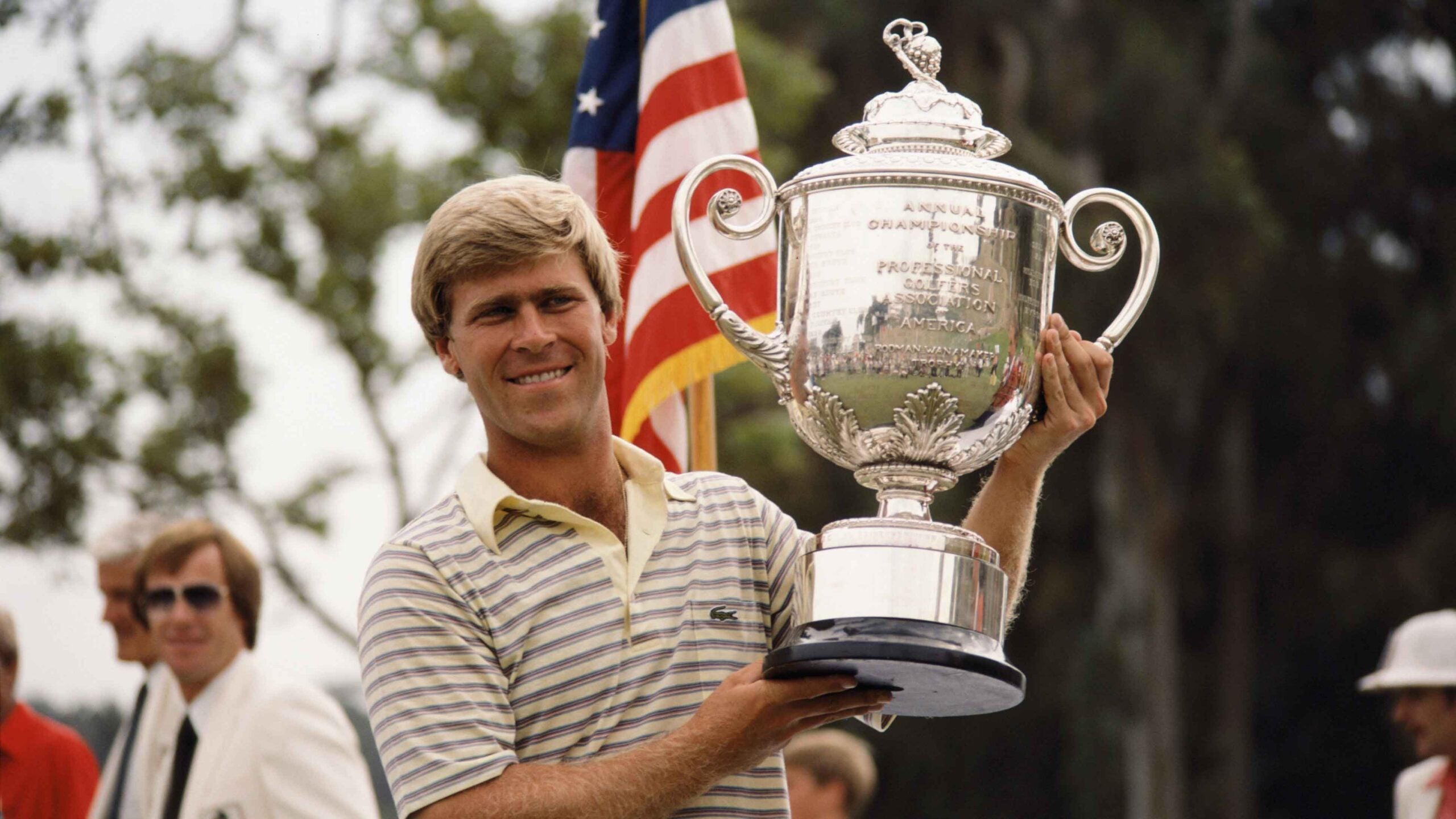 Hal Sutton of the USA lifts the winner's trophy after winning the 1983 USPGA at Riviera Country Club