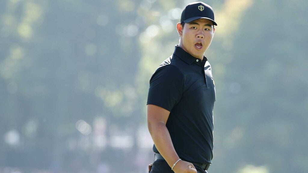 Tom Kim celebrates putt at the 2024 Presidents Cup.