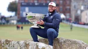 LIV pro Tyrrell Hatton celebrates with the trophy after winning on day Four of the 2024 Alfred Dunhill Links Championship, at the Old Course St. Andrews.