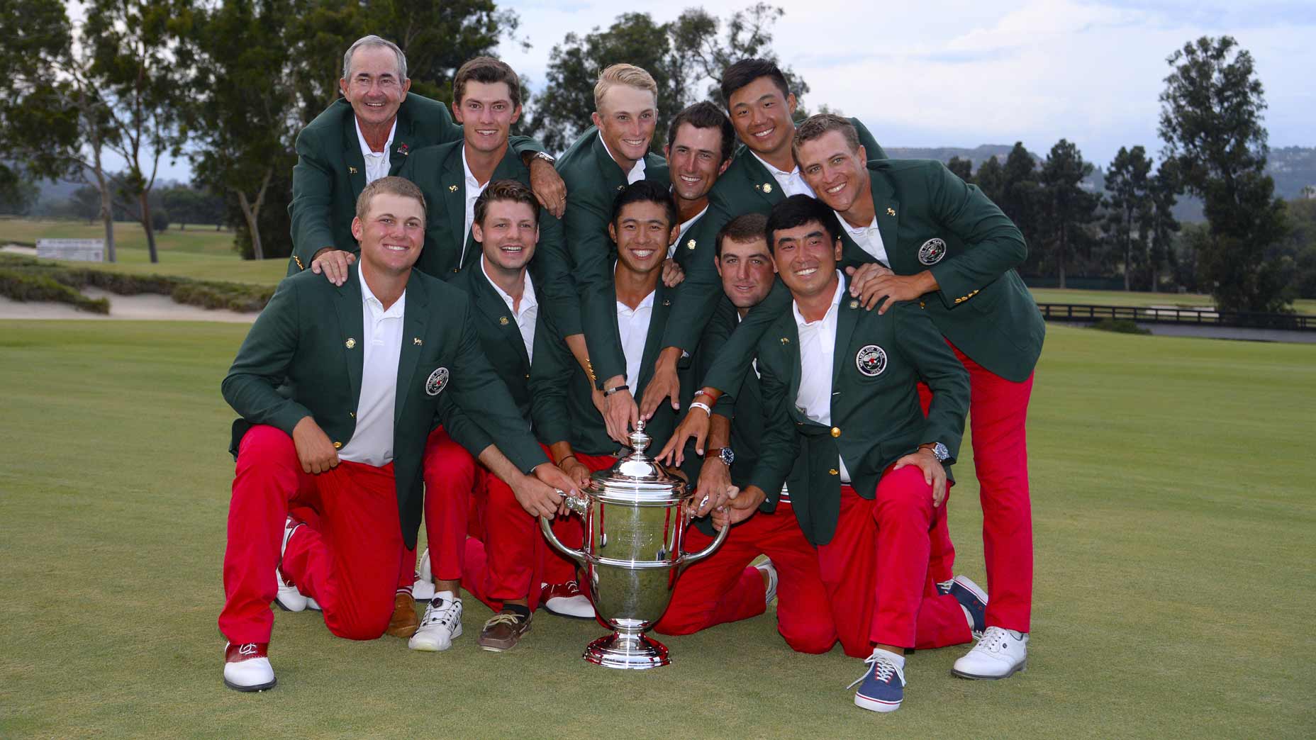 2007 U.S. Walker Cup team poses with trophy, including captain John "Spider" Miller, Maverick McNealy, Will Zalatoris, Stewart Hagestad, Norman Xiong, Cameron Champ, (Bottom L-R) Braden Thornberry, Doc Redman, Collin Morikawa, Scottie Scheffler, and Doug Ghim pose with the Walker Cup Trophy after defeating the Great Britain and Ireland Team 19-7.