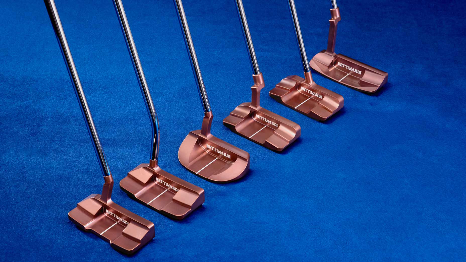 Bettinardi's 2025 Queen B putter lineup arranged on blue background.