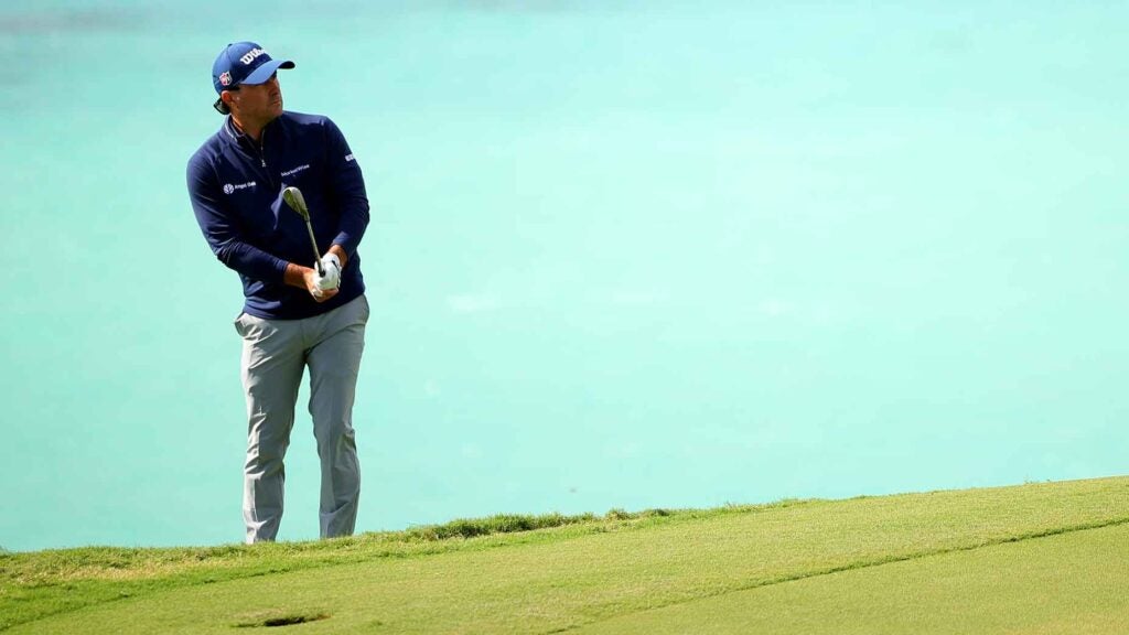 Kevin Kisner of the United States chip on the 16th green during the first round of the Butterfield Bermuda Championship 2024 at Port Royal Golf Course on November 14, 2024 in Southampton, Bermuda.