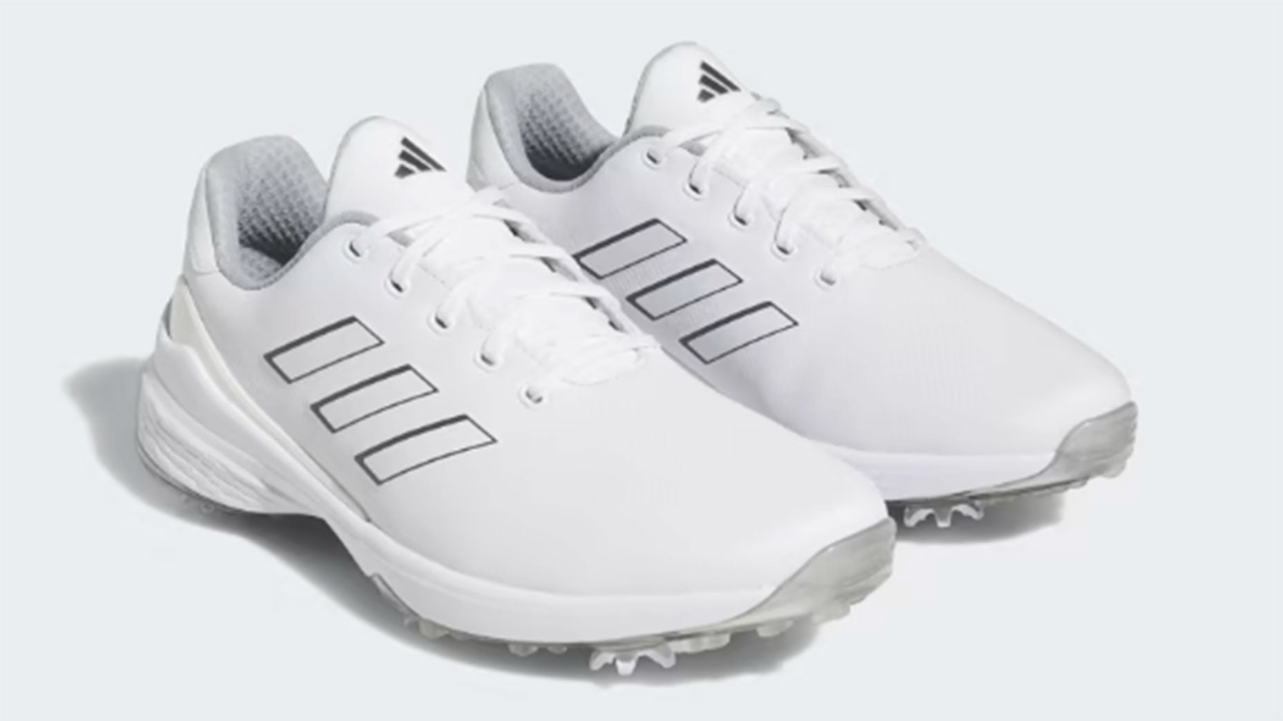 a pair of adidas golf shoes