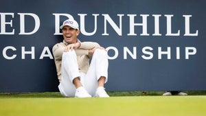 Billy Horschel sits against sign at Alfred Dunhill Links Championship.