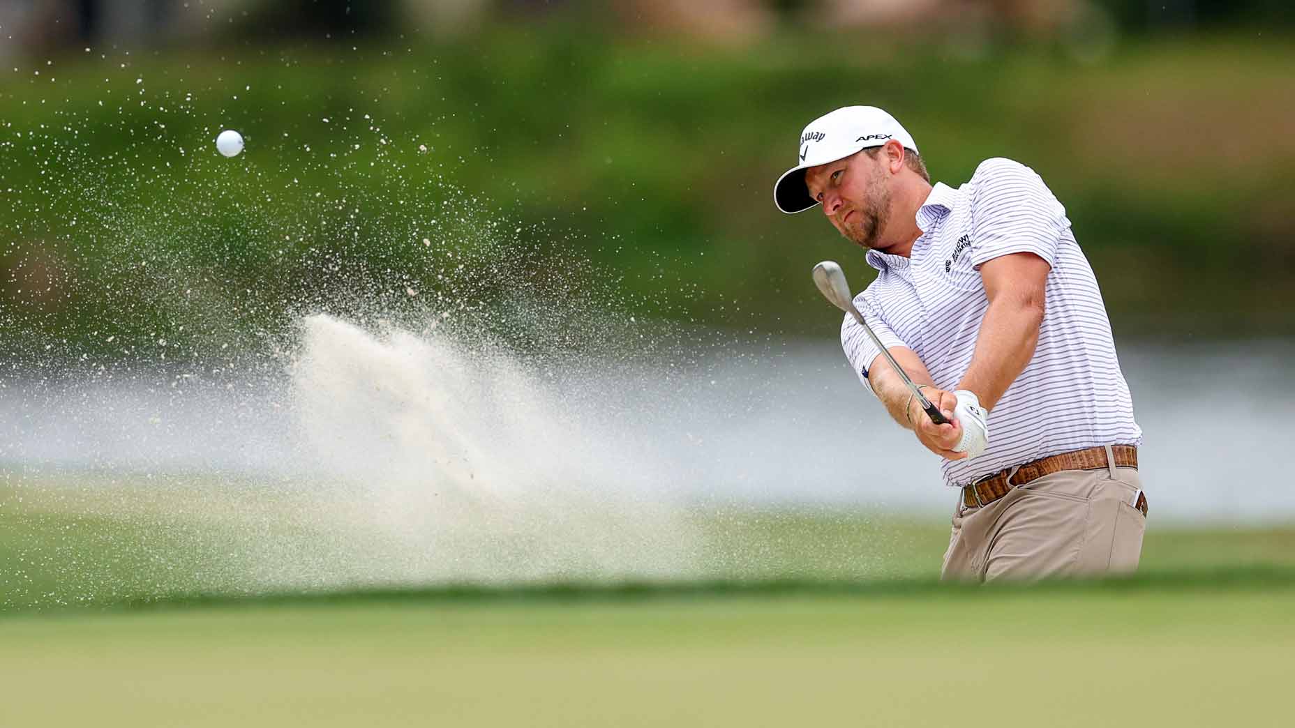 bryce garnett hits shot from greenside bunker