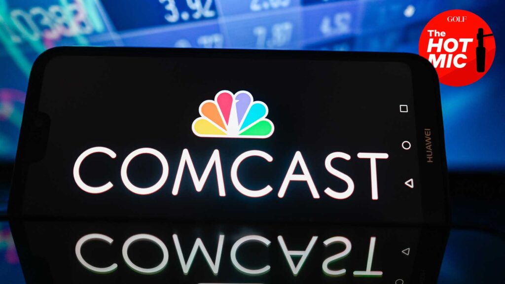 a phone screen sharing the comcast logo sits before a background with the hot mic logo