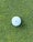 A single dot on the golf ball for putting alignment