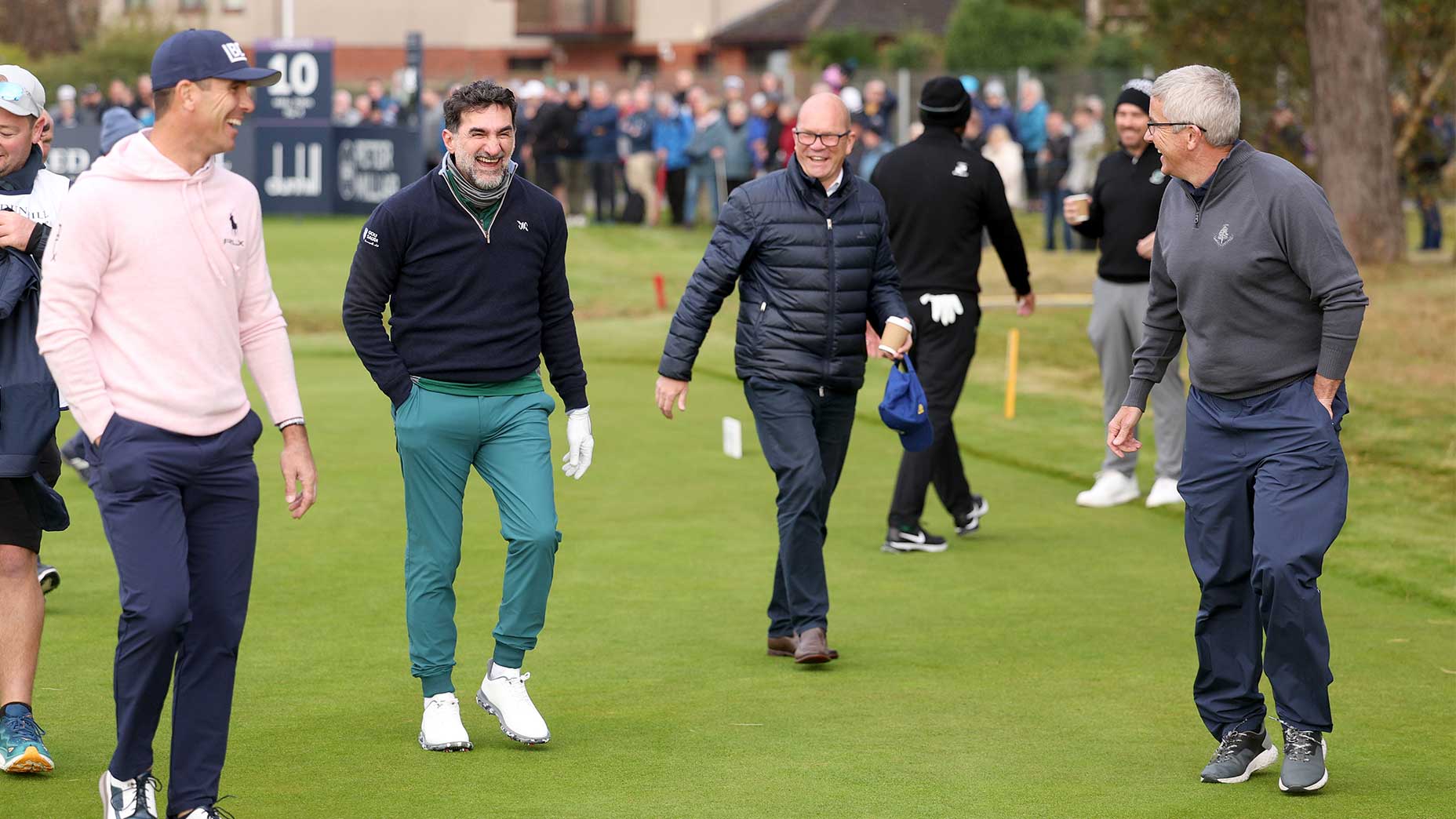 guy kinnings, jay monahan, yasir al-rumayyan and billy horschel walk laughing at Carnoustie during the Alfred Dunhill Links Championship