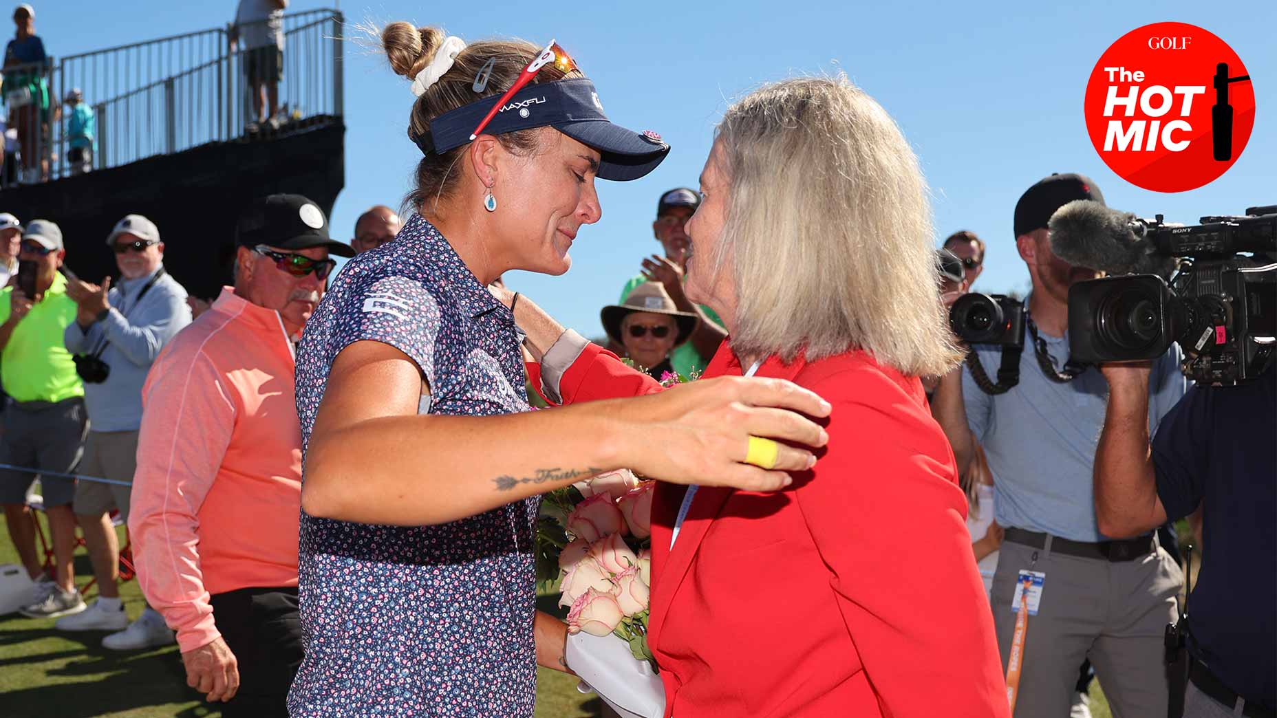 lexi thompson hugs molly marcoux samaan off the 9th green at the CME Group Tour Championship.