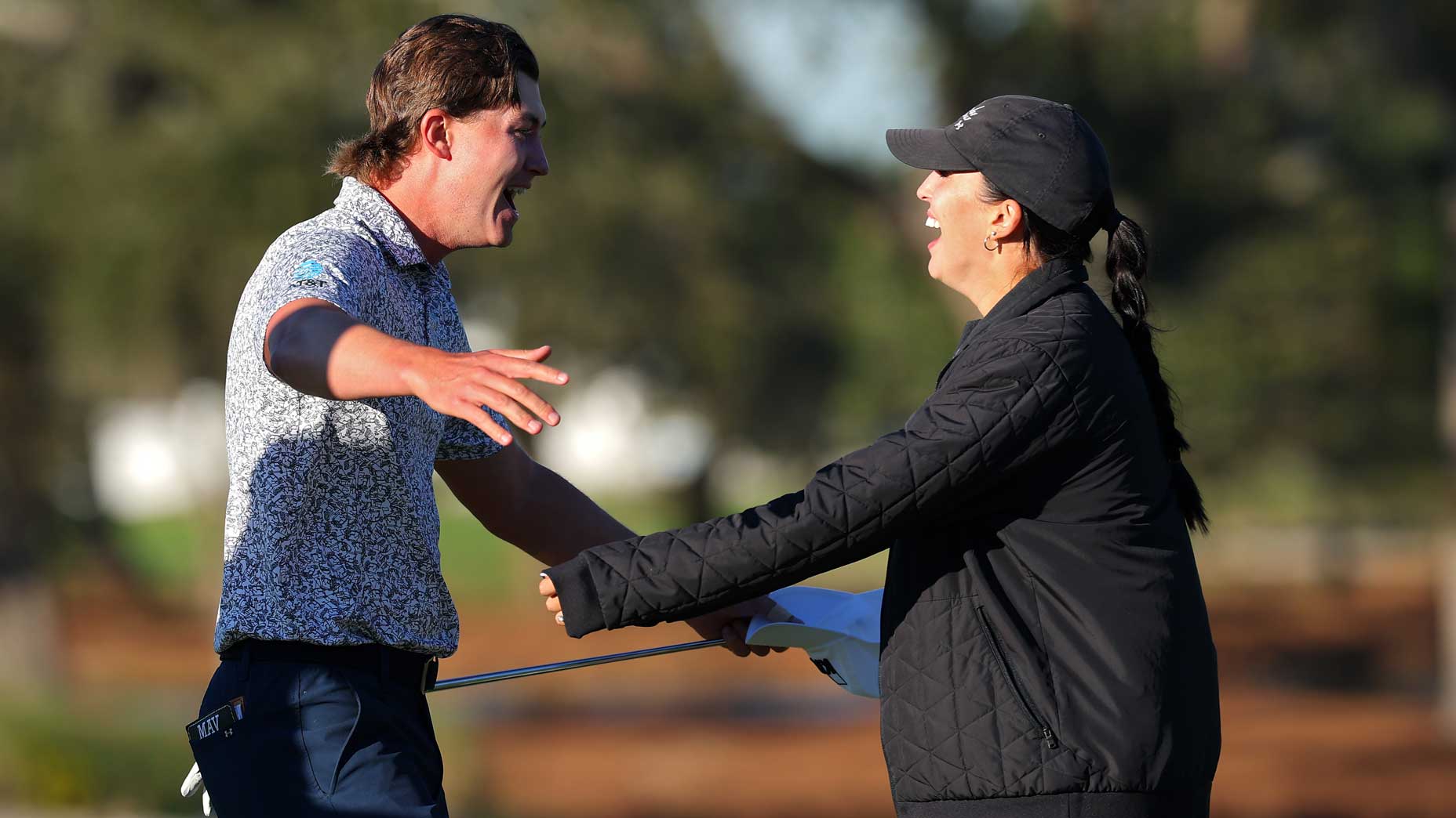 PGA Tour pro Maverick McNealy celebrates with wife Maya Daniels after winning The RSM Classic 2024 at Sea Island Resort.