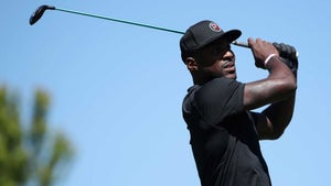 NFL player Patrick Peterson holds his finish after hitting a a golf shot