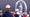 tiger woods stares at the open in navy crewneck and white hat at the open at royal troon