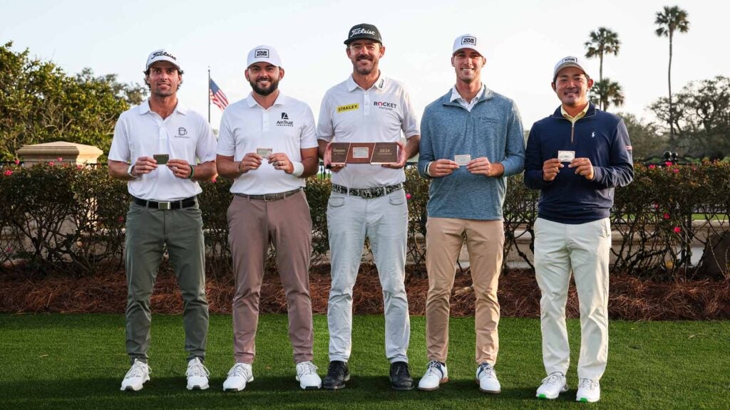 The top six players at PGA Tour Q-School pose with PGA Tour cards.