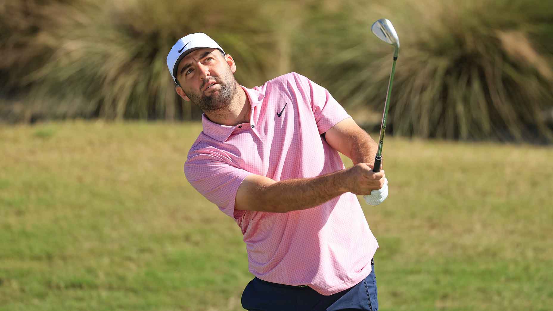 Scottie Scheffler of The United States plays a chip shot during his practice session on the range as a preview for the Hero World Challenge 2024 at Albany Golf Course on December 03, 2024 in Nassau, Bahamas.