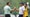 bryson dechambeau in mint green shirt shakes hands with brooks koepka in white shirt at 2023 PGA Championship.