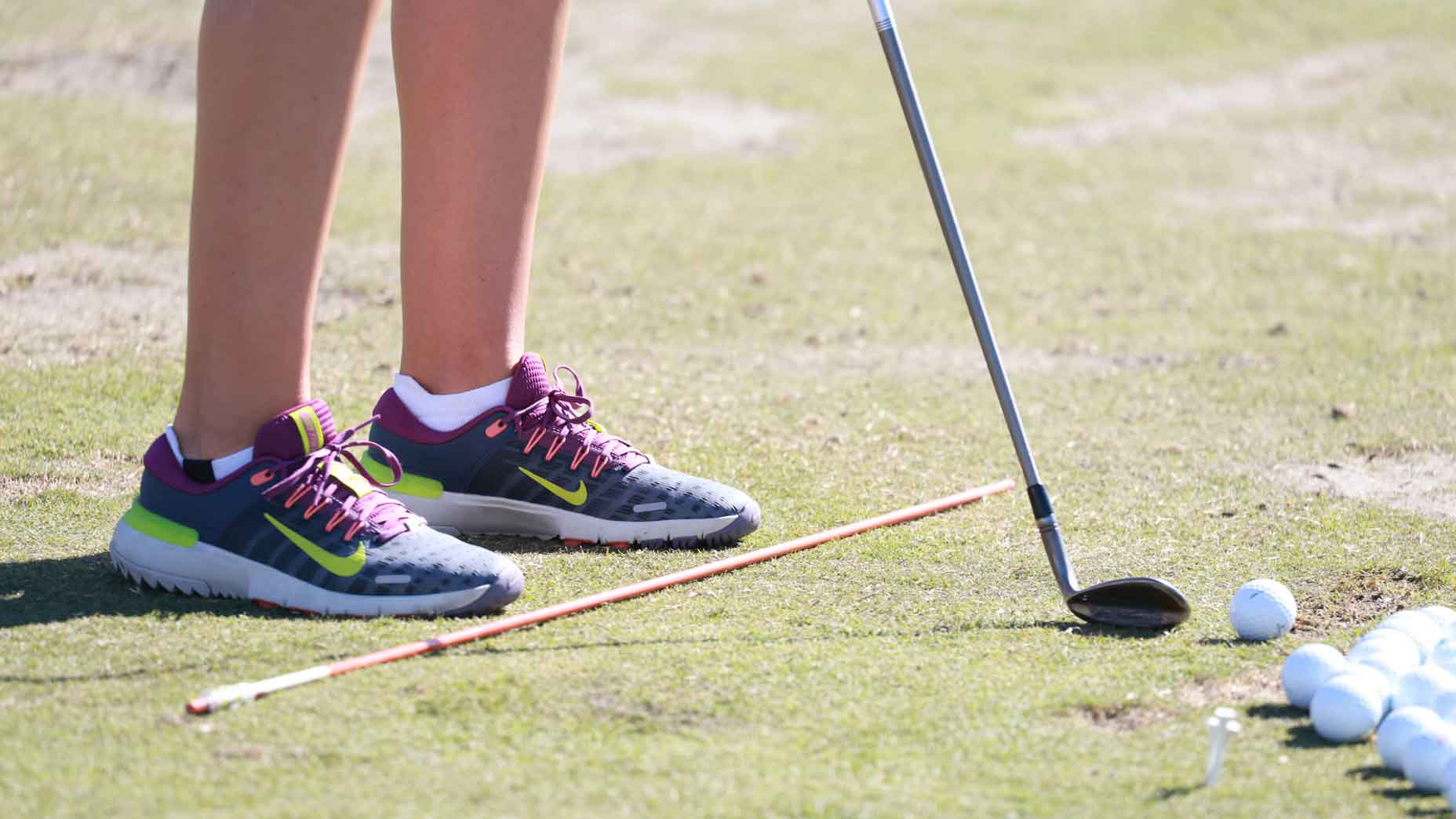 A close up of the shoes worn by LPGA golfer Nelly Korda as she warms up at the practice range on November 15, 2024, during the second round of the LPGA The ANNIKA driven by Gainbridge at Pelican Golf Club in Belleair, Florida.