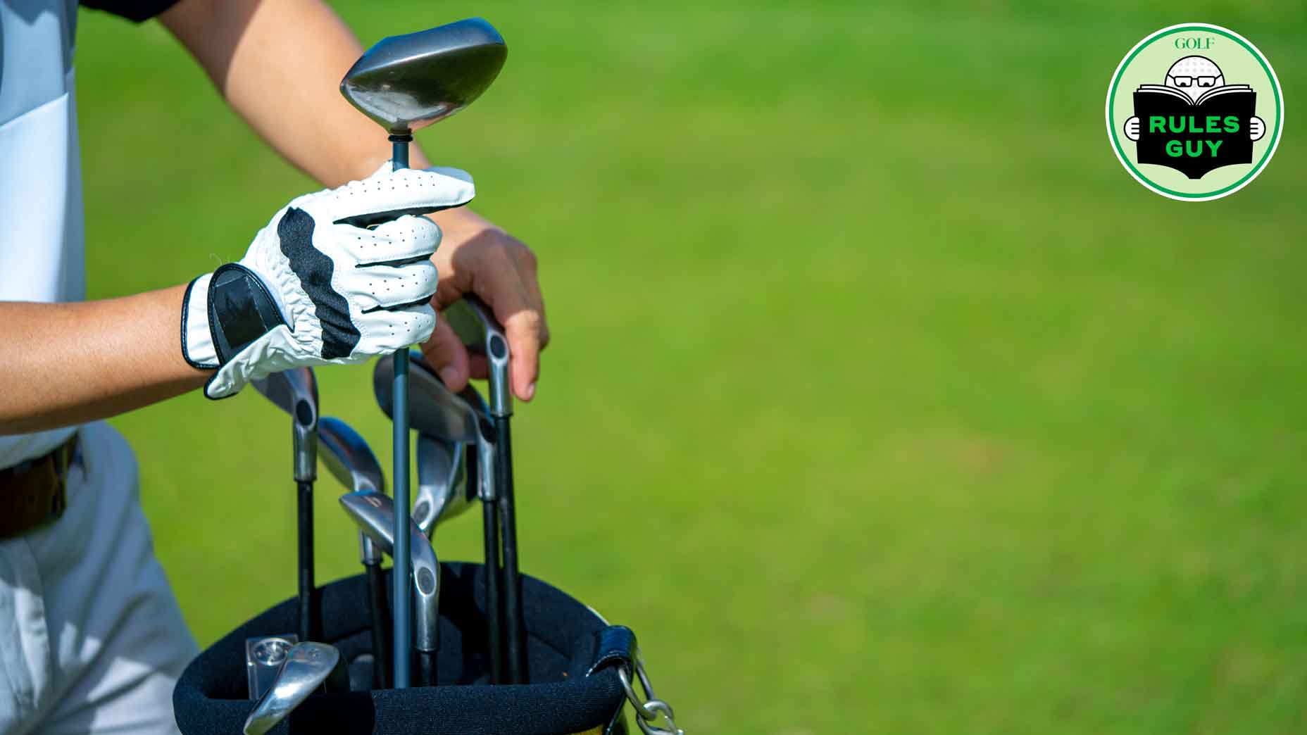 Golfer's hand reaching for club in bag