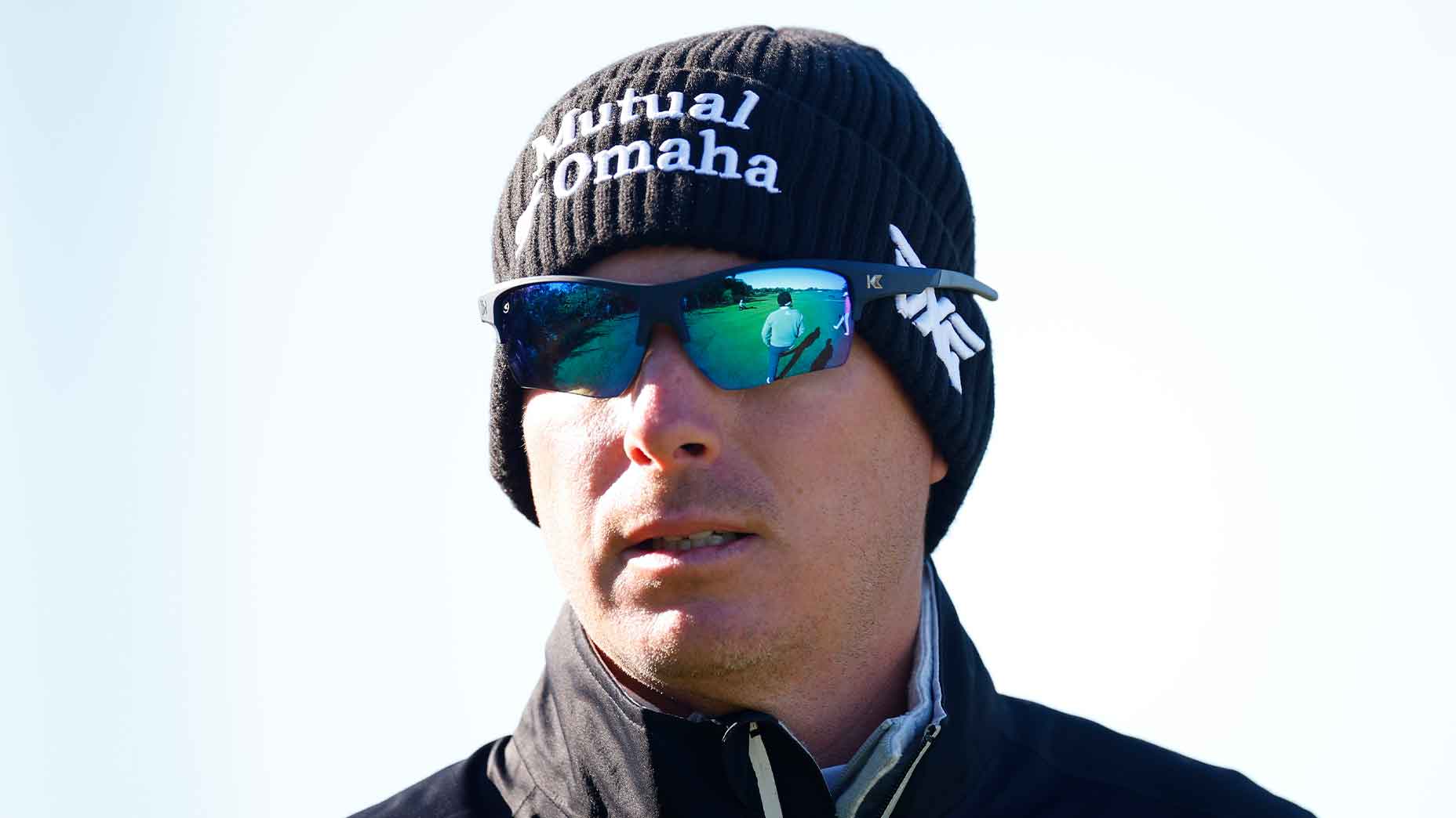 joel dahmen stares in beanie and sunglasses at RSM Classic.