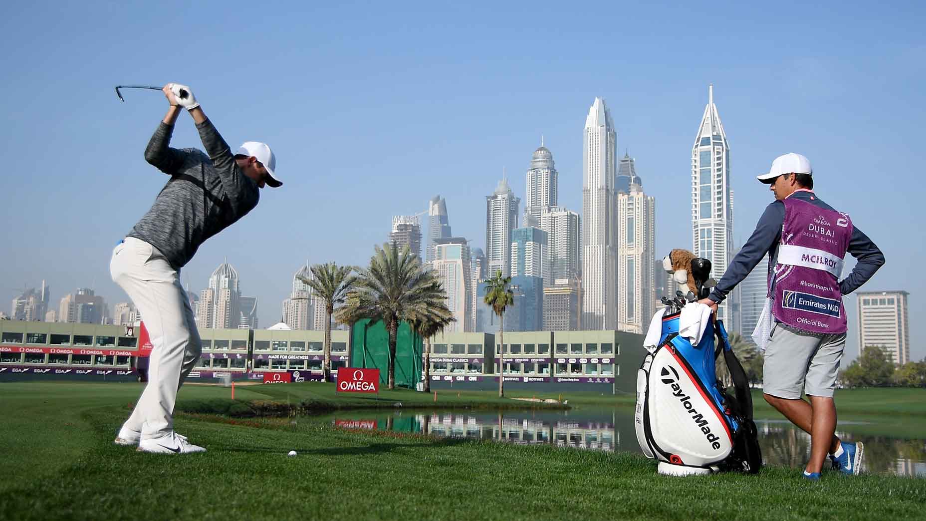 rory mcilroy swings during the 2024 dubai desert classic