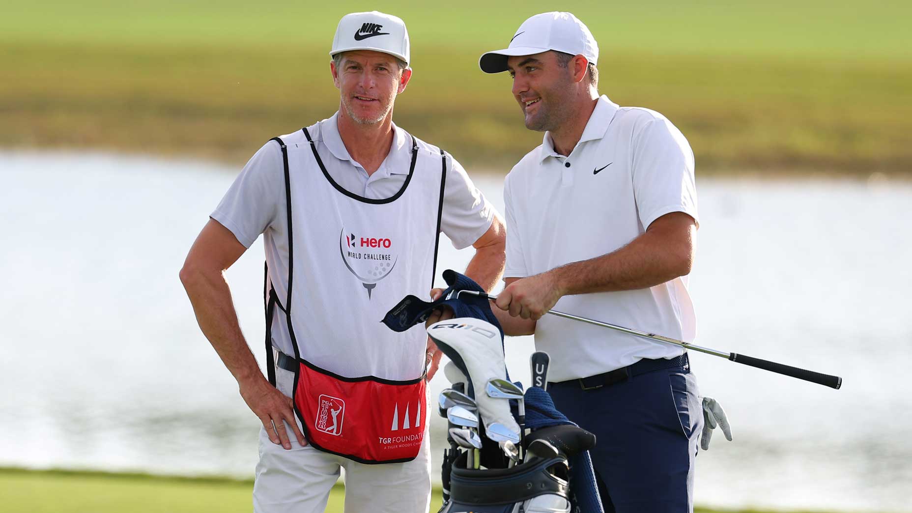 Pro golfer Scottie Scheffler and his partner, Ted Scott, prepare to tee off on the 18th hole in the first round of the Hero World Challenge 2024 at Albany Golf Course.