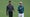 Tiger Woods and Justin Thomas walk down the first fairway during a practice round prior to the 2024 Masters Tournament at Augusta National Golf Club.