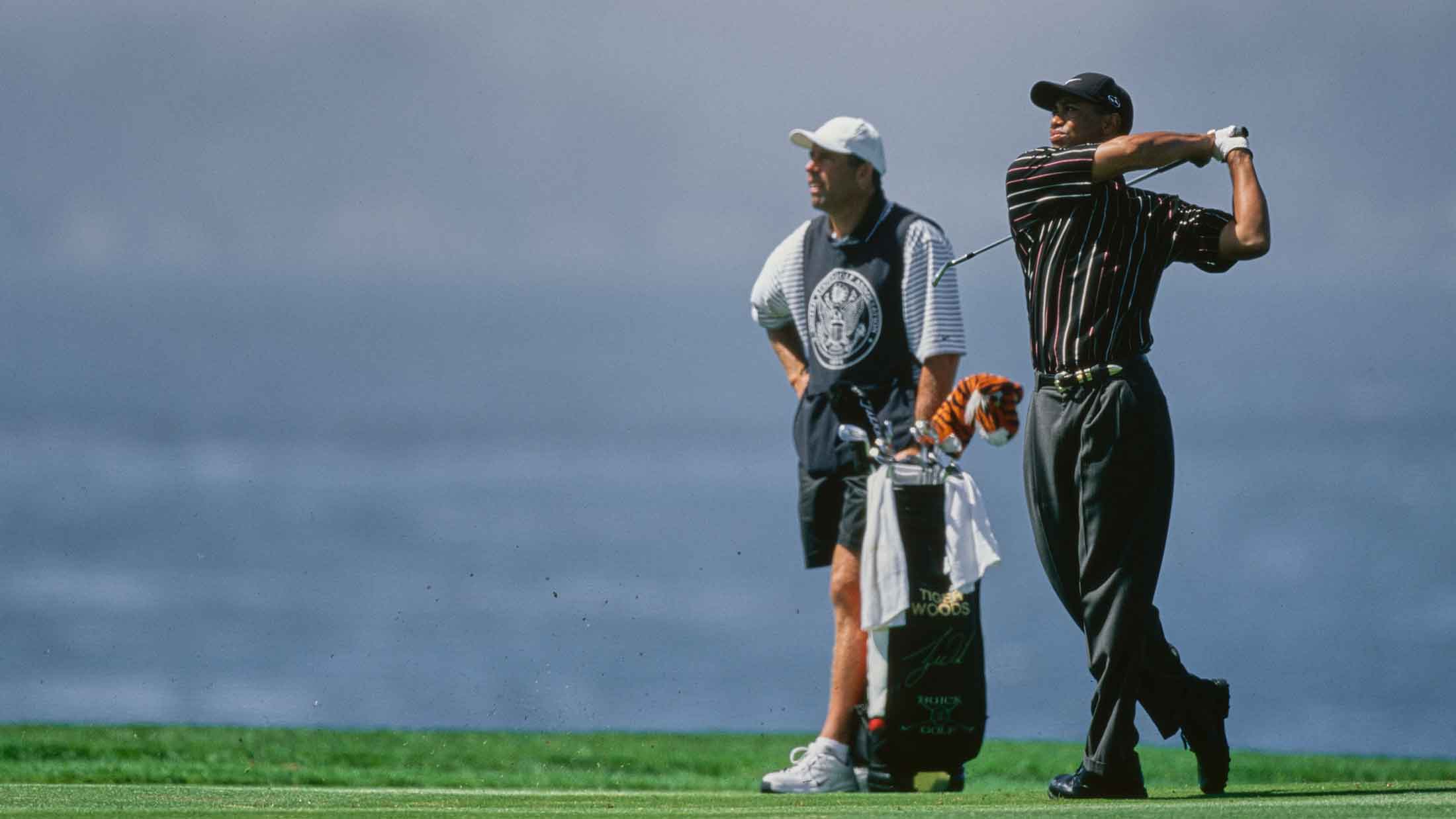 Tiger Woods from the United States with caddie Steve Williams at 100th United States Open golf tournament on 17th June 2000 at the Pebble Beach