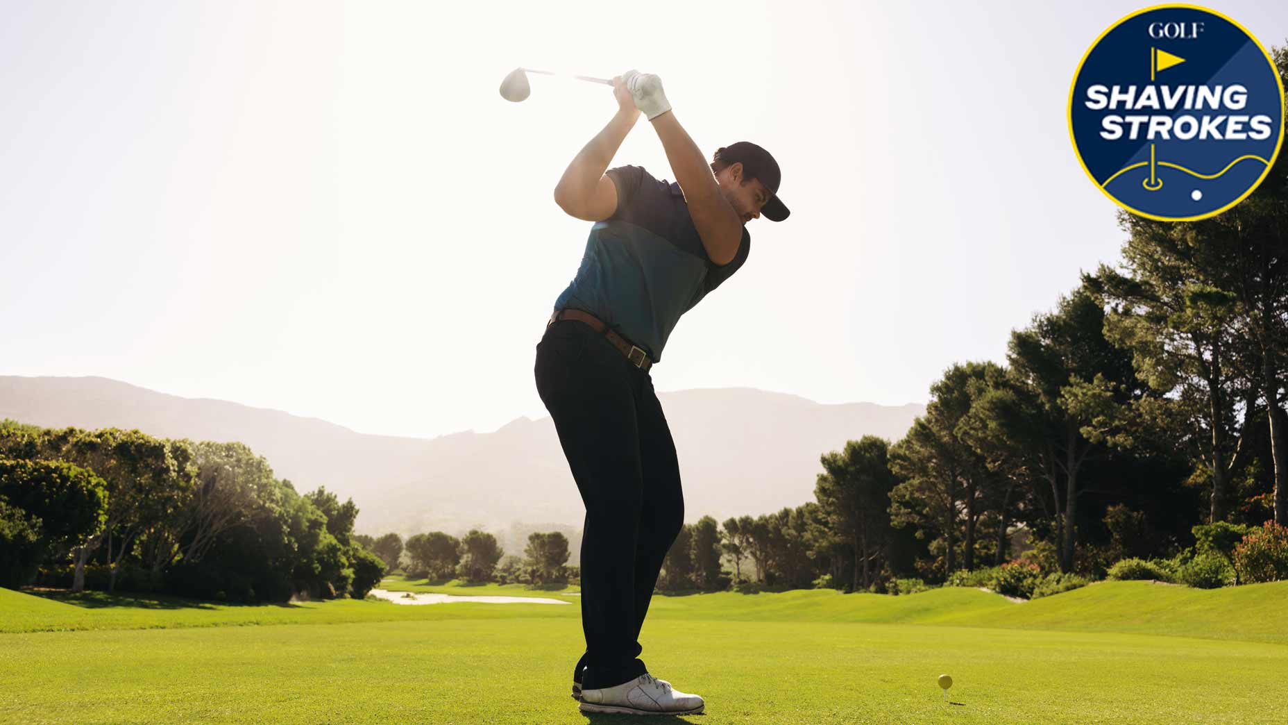 Golfer at the top of the swings