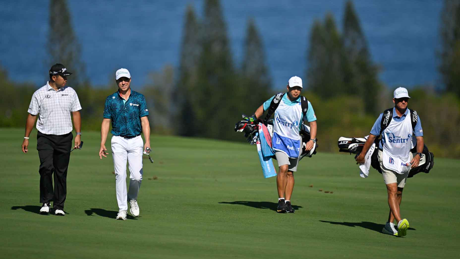 Hideki Matsuyama of Japan and Justin Thomas walk together along the fourth fairway during the second round of The Sentry at The Plantation Course at Kapalua on January 3, 2025 in "Kapalua, Maui", Hawaii.