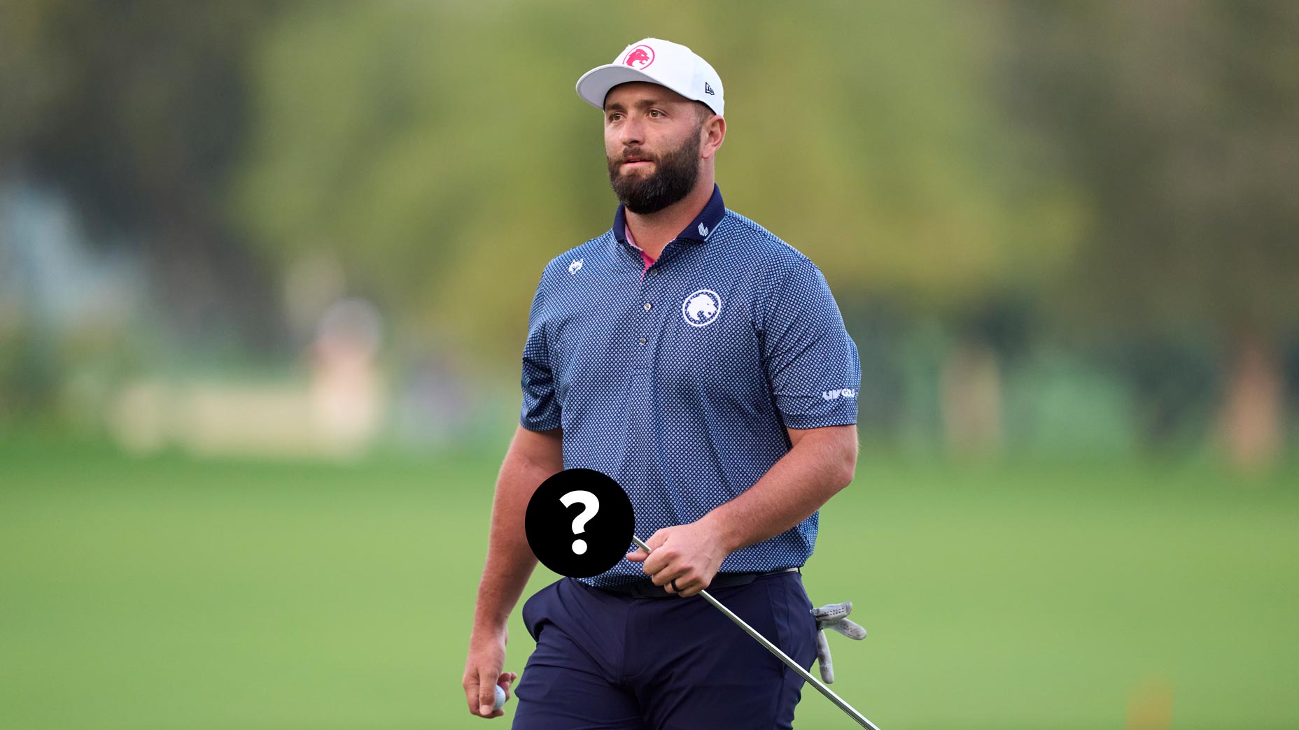 Jon Rahm holds his putter at the Hero Dubai Desert Classic.