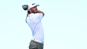 Max Homa hits a tee shot at Kapalua