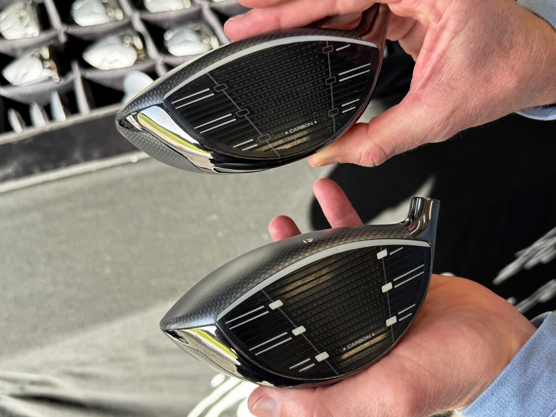 A TaylorMade Qi35 SelectFit head and a standard Qi35 head.