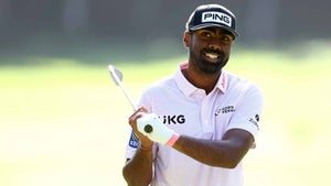 Sahith Theegala smiles at the Kapalua driving range.