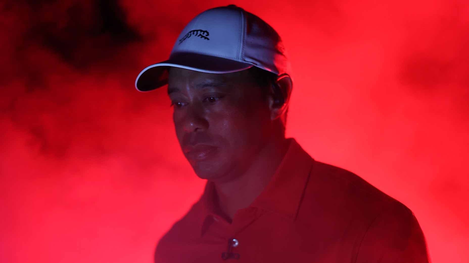 Tiger Woods' TGL debut started in a red, foggy tunnel.