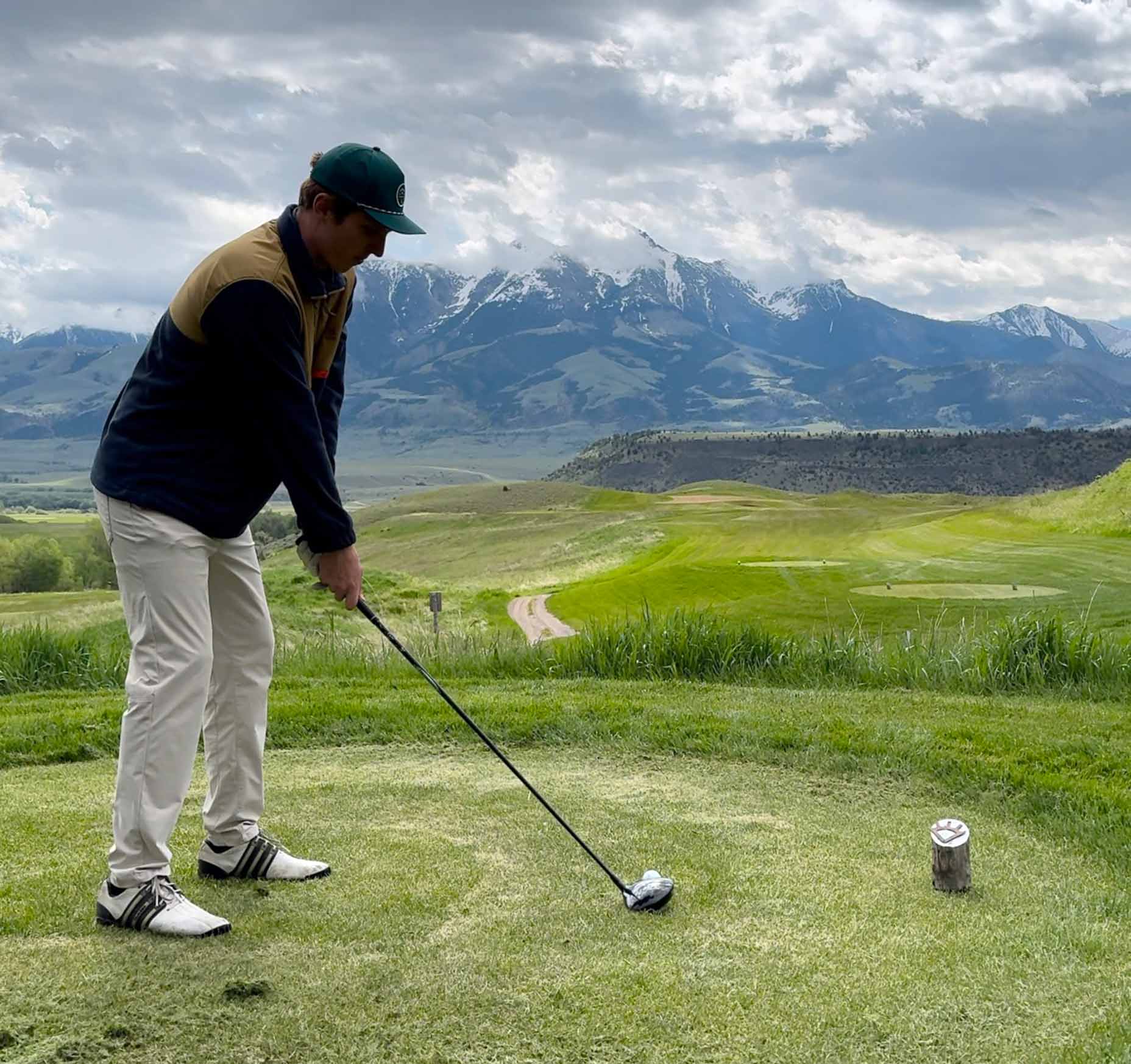 a golfer tees off at rising sun golf course