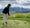 a golfer tees off at rising sun golf course