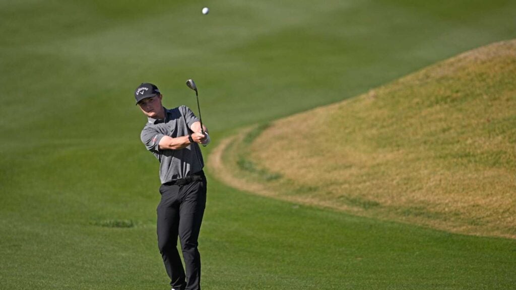 Blades Brown hits a shot during the second round of the American Express.